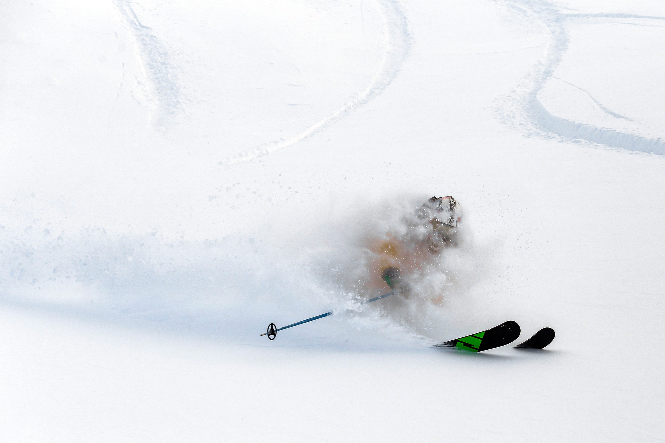 Skier enjoying deep powder snow on a guided ski trip in Japan